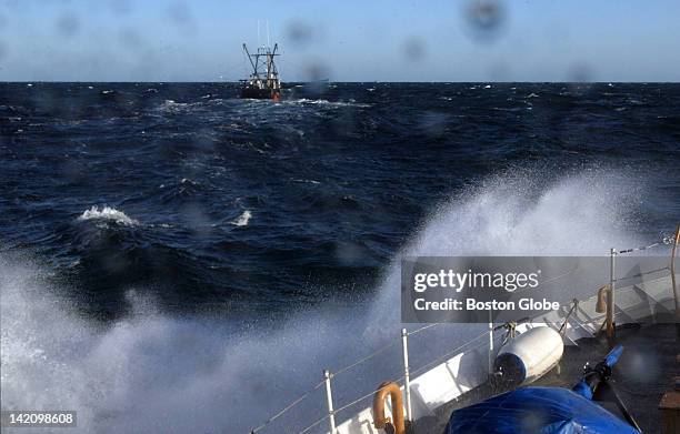 The Coast Guard cutter Bainbridge Island bears down on a fishing boat 30 miles east of Nantucket. The cutter contacted the captain by radio to file a...