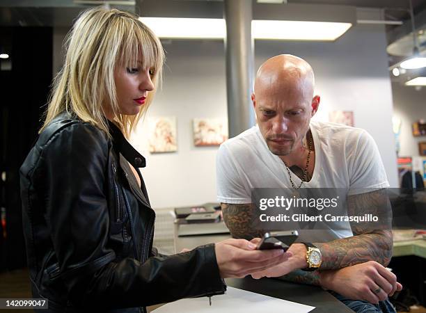 Lead singer Camilla Romestrand of the UK rock band Eddie The Gun discusses a tattoo design with tattoo artist Ami James to promote the release of the...