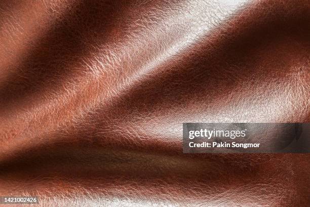 close-up of a brown leather and textured background. - animal skin stockfoto's en -beelden