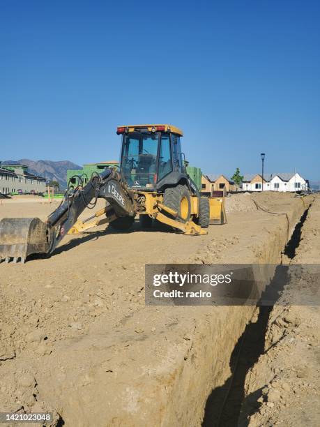 Backhoe Trenches 71 Deere Excavator Stock Photos, High-Res Pictures, and Images - Getty ...