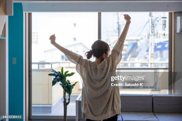 woman stretching in the morning - leisure activity home stock pictures, royalty-free photos & images