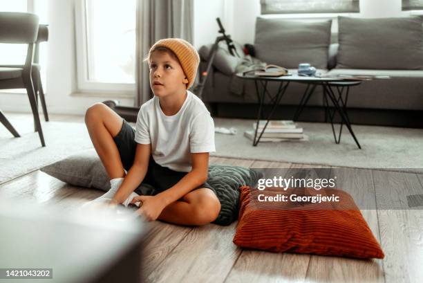 playing video games at home - game controller stock pictures, royalty-free photos & images