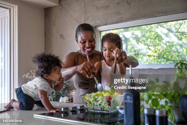 multi-ethnic family during a week-end - mom child salad stock pictures, royalty-free photos & images