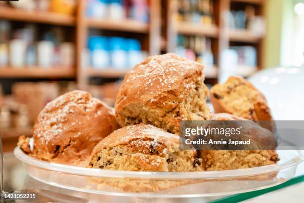 plate of freshly baked fruit scones - scone stock pictures, royalty-free photos & images