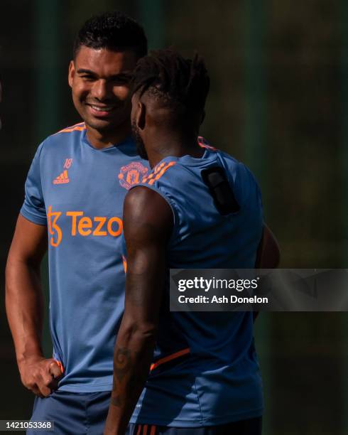 Casemiro and Fred of Manchester United i action during a first team training session at Carrington Training Ground on September 05, 2022 in...