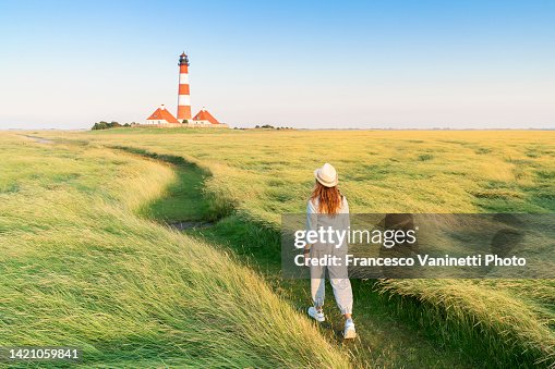 Woman at Westerheversand lighthouse, Germany. Woman at Westerheversand lighthouse, Germany.