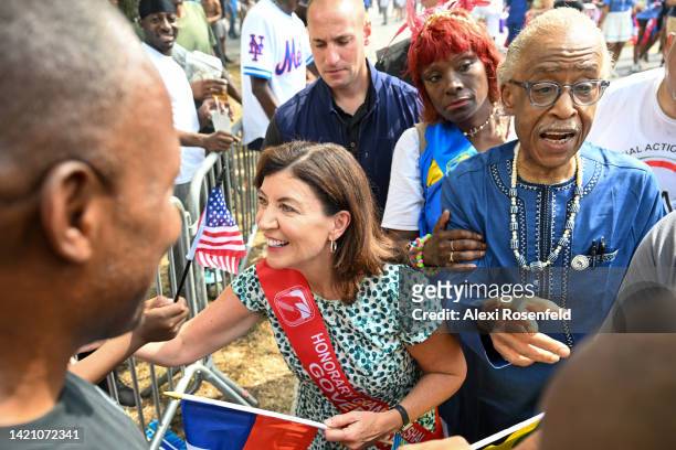 New York Governor Kathy Hochul and Rev. Al Sharpton greet spectators at the annual West Indian Day parade on September 5, 2022 in the Brooklyn...