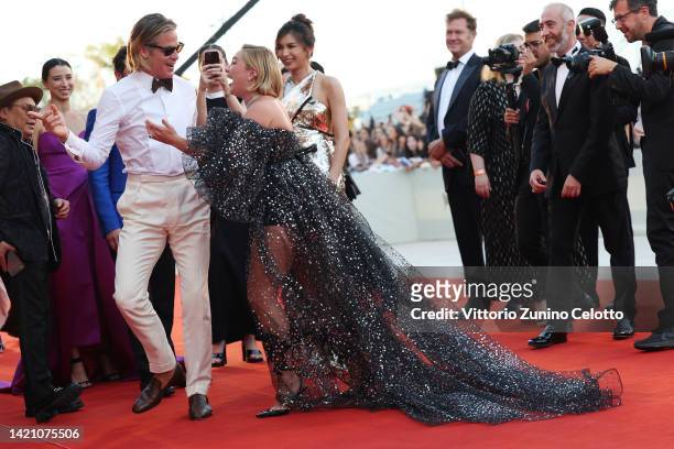 Chris Pine greets Florence Pugh on the "Don't Worry Darling" red carpet at the 79th Venice International Film Festival on September 05, 2022 in...