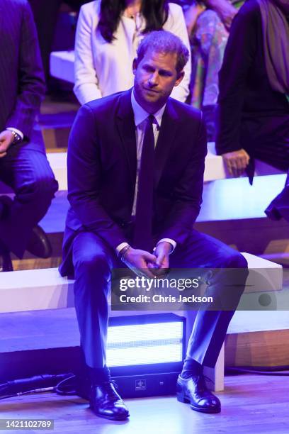 Prince Harry, Duke of Sussex watches Meghan, Duchess of Sussex makes the keynote speech during the Opening Ceremony of the One Young World Summit...