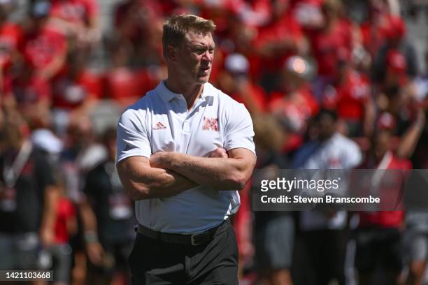 Head coach Scott Frost of the Nebraska Cornhuskers watches the team warm up before the game against the North Dakota Fighting Hawks at Memorial...