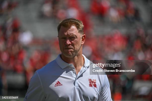 Head coach Scott Frost of the Nebraska Cornhuskers watches the team warm up before the game against the North Dakota Fighting Hawks at Memorial...