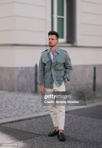Andre Hellmundt wearing Belstaff jacket, Olymp shirt, Breitling watch, Gant shoes, Rebele trousers on August 31, 2022 in Berlin, Germany.