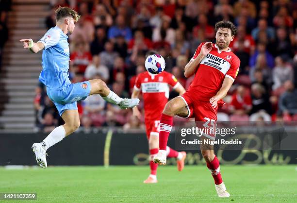 Dennis Cirkin of Sunderland is challenged by Matt Crooks of Middlesbrough during the Sky Bet Championship match between Middlesbrough and Sunderland...