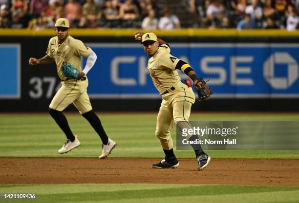 Wilmer Difo of the Arizona Diamondbacks makes a throw to first base against the Milwaukee Brewers at Chase Field on September 02, 2022 in Phoenix,...