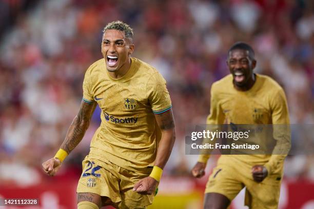 Raphael Dias Belloli 'Raphinha' of FC Barcelona celebrates scoring their teams first goal with team mates during the LaLiga Santander match between...