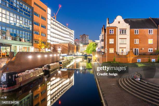 birmingham united kingdom night view over the historic canal with bridges and narrow boats in view - west midlands uk stock pictures, royalty-free photos & images