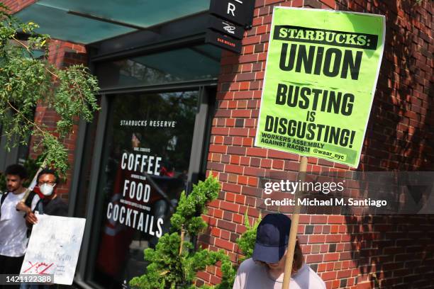 Pro-union protestors hold signs during a rally near the home of Starbucks’ interim CEO Howard Schultz on September 05, 2022 in New York City. Members...