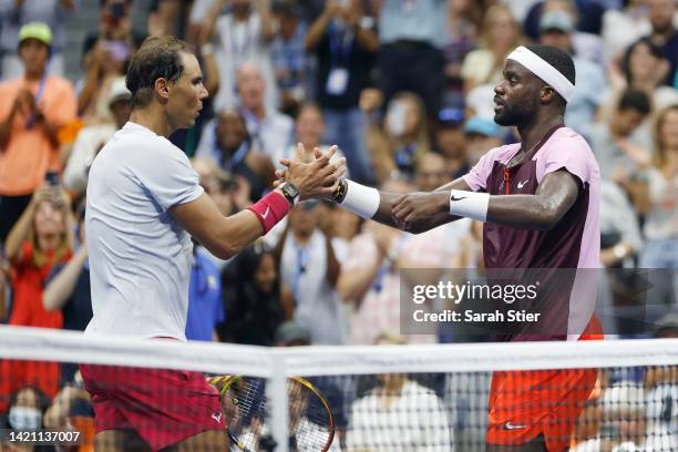 Frances Tiafoe of the United States shakes hands after defeating Rafael Nadal of Spain during their Men’s Singles Fourth Round match on Day Eight of...