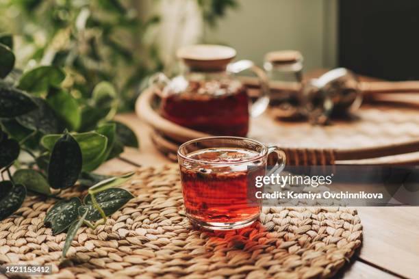 hot steaming black tea in a cup on a rustic background - rose hip stock pictures, royalty-free photos & images