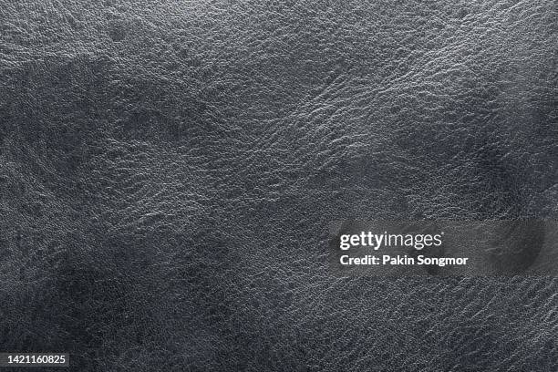 close-up of a black leather and textured background. - black leather texture stock-fotos und bilder