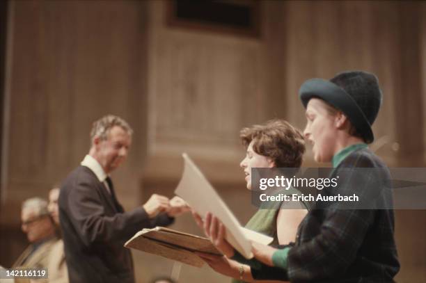 English composer Benjamin Britten conducts British opera singers Heather Harper and Josephine Veasey, circa 1963.