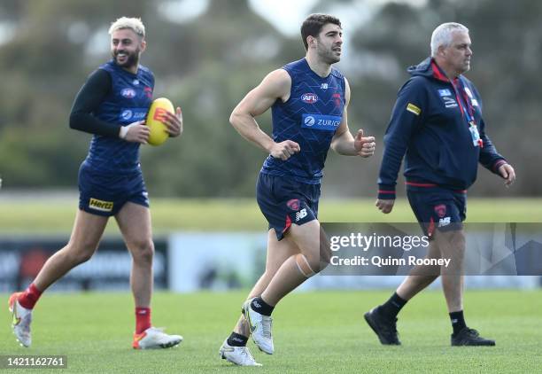 Christian Petracca of the Demons runs with team mates during a Melbourne Demons AFL training session at Casey Fields on September 06, 2022 in...