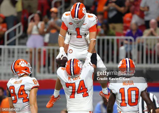 Will Shipley of the Clemson Tigers reacts after rushing for a touchdown against the Georgia Tech Yellow Jackets during the second quarter with Marcus...