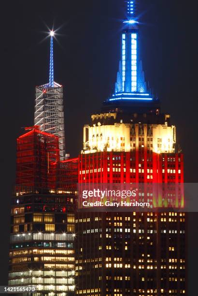 The Empire State Building and One Vanderbilt are both lit in red, white and blue as they honor American workers on Labor Day in New York City on...