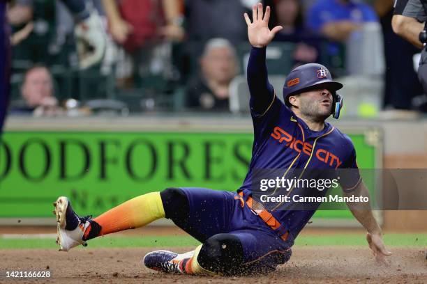 Jonah Heim of the Texas Rangers tags out Jose Altuve of the Houston Astros during the eighth inning at Minute Maid Park on September 05, 2022 in...