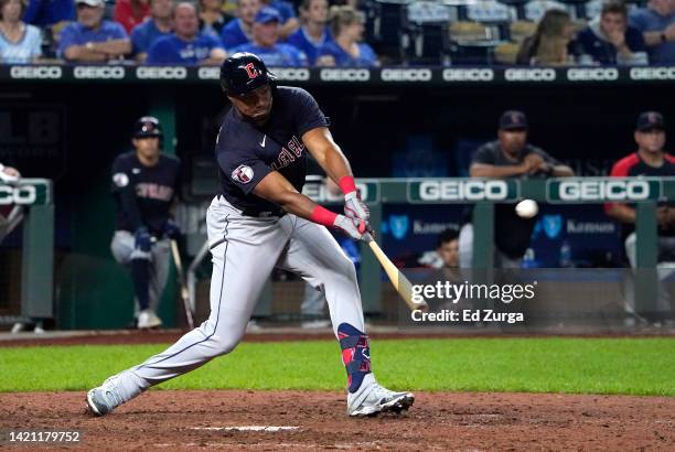 Oscar Gonzalez of the Cleveland Guardians hits a two-run double in the 10th inning against the Kansas City Royals at Kauffman Stadium on September...