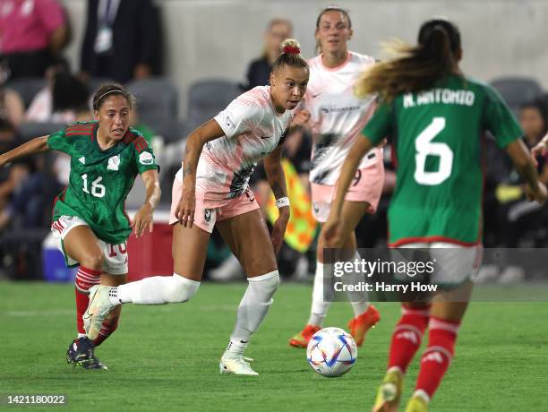 Vignola comes away with the ball from Eva Gonzalez of Mexico in the second half as Mexico defeats Angel City FC 2-0 during Copa Angelina 2022 at Banc...