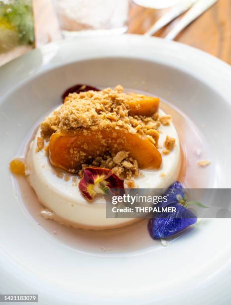 panna cotta dessert with fruits and almond crumble - panna cotta stock pictures, royalty-free photos & images