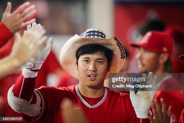 Shohei Ohtani of the Los Angeles Angels celebrates his second home run of the game in the seventh inning against the Detroit Tigers at Angel Stadium...