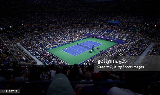 General view Carlos Alcaraz of Spain returns a ball against Marin Cilic of Croatia during their Men’s Singles Fourth Round match on Day Eight of the...