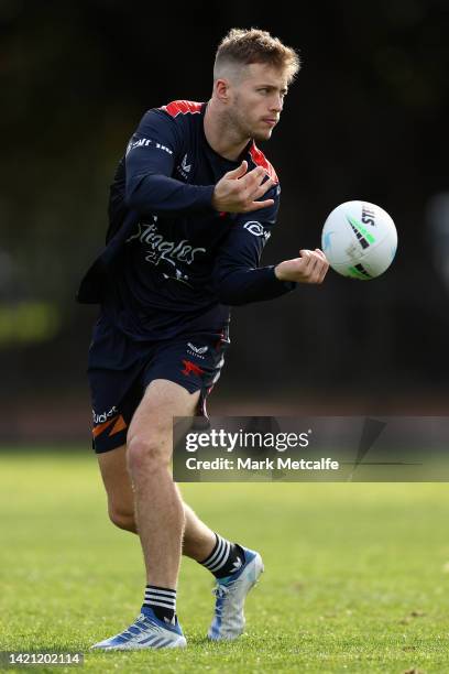 Sam Walker of the Roosters passes during a Sydney Roosters NRL training session at Kippax Lake on September 06, 2022 in Sydney, Australia.