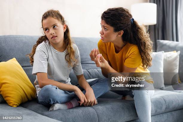 rude girl ignoring what her single mother is telling her at home. - avoid conflict stock pictures, royalty-free photos & images