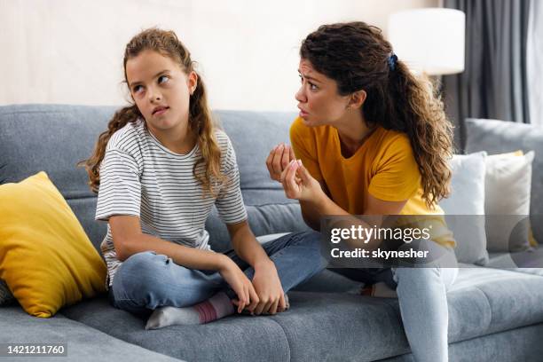 rude girl ignoring what her single mother is telling her at home. - disrespect imagens e fotografias de stock