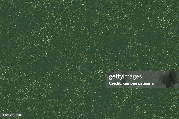 green background with gold glitter - green confetti stock pictures, royalty-free photos & images