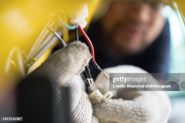 mechanic repairing motor cycle. - electric motor disassembled stock pictures, royalty-free photos & images