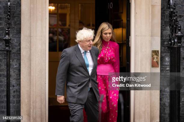 British Prime Minister Boris Johnson arrives with his wife Carrie Johnson as he prepares to deliver a farewell address before his official...
