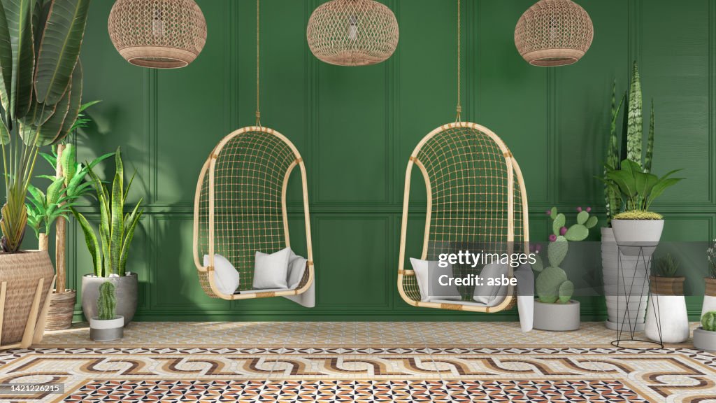 居心地の良い出会いの場所緑の木の壁と植物のある2つのハンモック