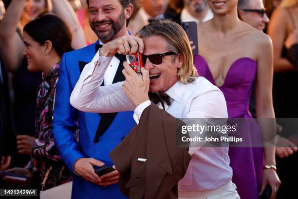 Chris Pine takes a picture on the "Don't Worry Darling" red carpet at the 79th Venice International Film Festival on September 05, 2022 in Venice,...