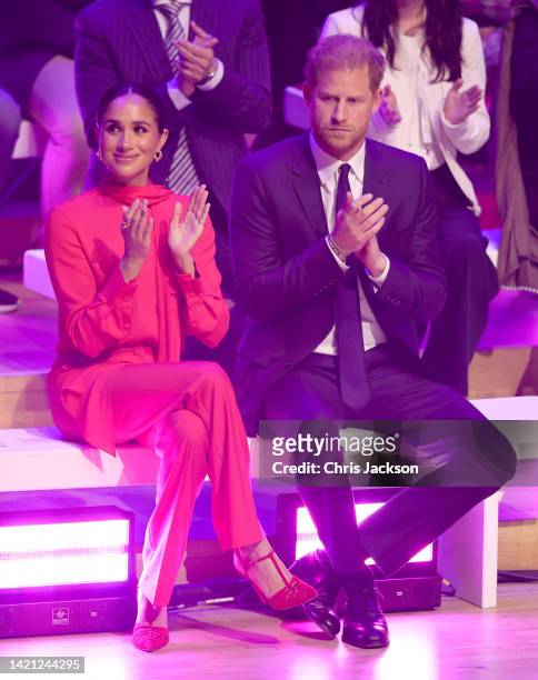 Prince Harry, Duke of Sussex and Meghan, Duchess of Sussex sit onstage during the Opening Ceremony of the One Young World Summit 2022 at The...