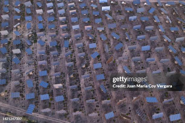 aerial view of an old abandoned solar panels farm (solar panel) with sunlight at sunset 08 - maria castellanos fotografías e imágenes de stock