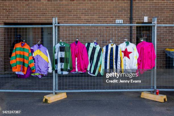 Racing silks hang on a fence during the barrier trials at Rosehill Gardens on September 06, 2022 in Sydney, Australia.
