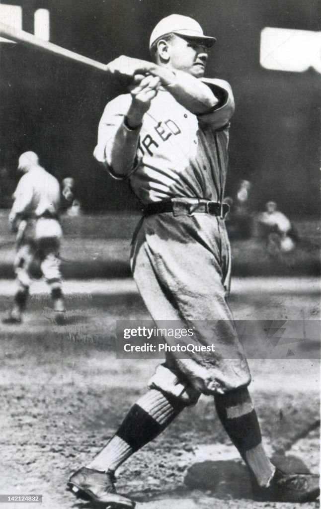 American baseball player Babe Ruth , of the Boston Red Sox, swings a ...