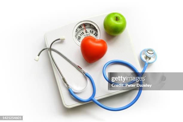 stethoscope, apple and heart - diabetes and heart disease stock pictures, royalty-free photos & images