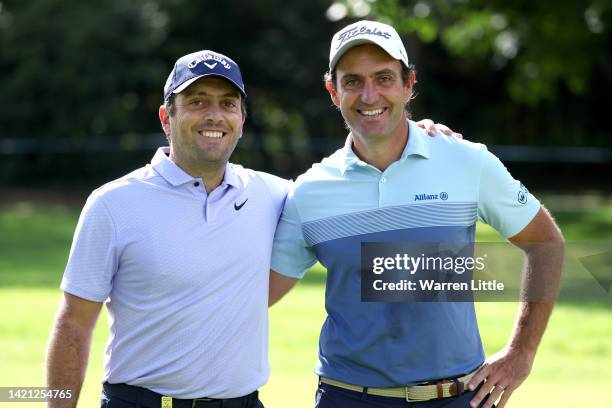 Brothers Francesco Molinari and Edoardo Molinari of Italy pose for a photograph on the 1st hole during a practice round prior to the BMW PGA...