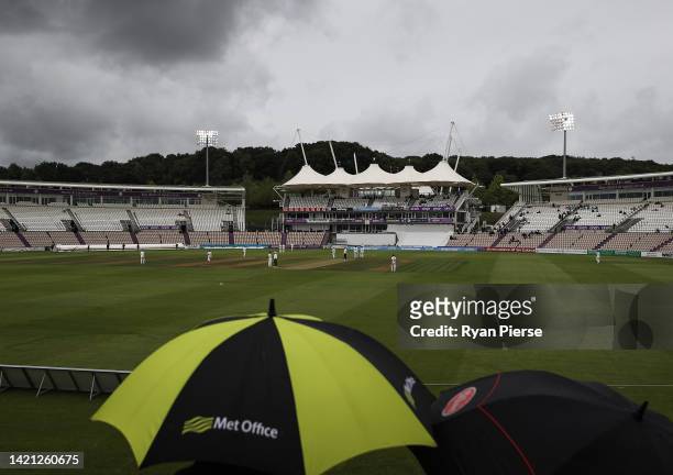 Players leave the ground as rain stops play during day two of the LV= Insurance County Championship match between Hampshire and Northamptonshire at...