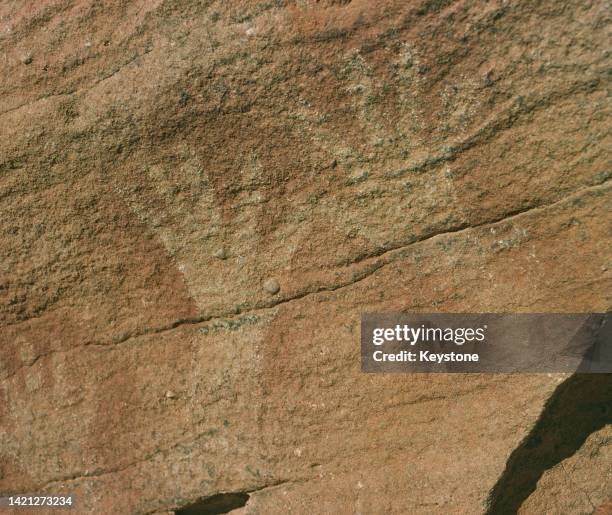 Stencils of Aboriginal hands, an example of the Aboriginal rock art and engravings at Mutawintji National Park in the Far West region of New South...